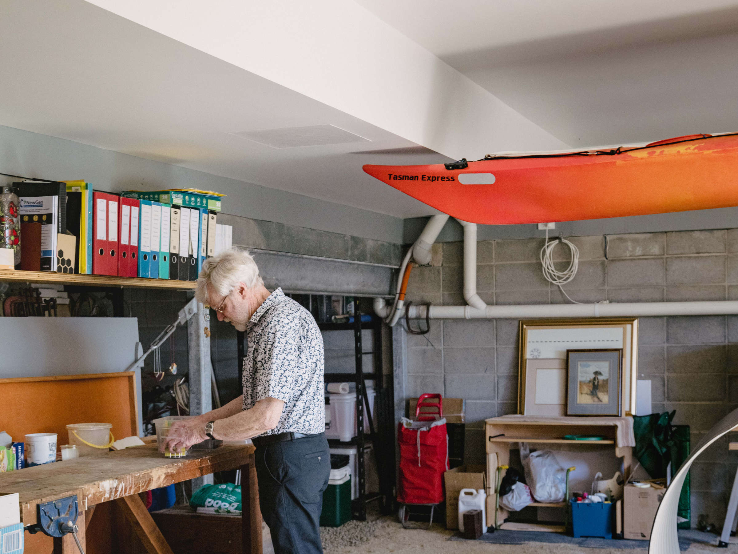 This garage-style renovation of an existing space was simple and considered the fire risk. It features a plastered ceiling and a compacted floor of crushed limestone and a cute little dog. Credit: Jordan Davis.