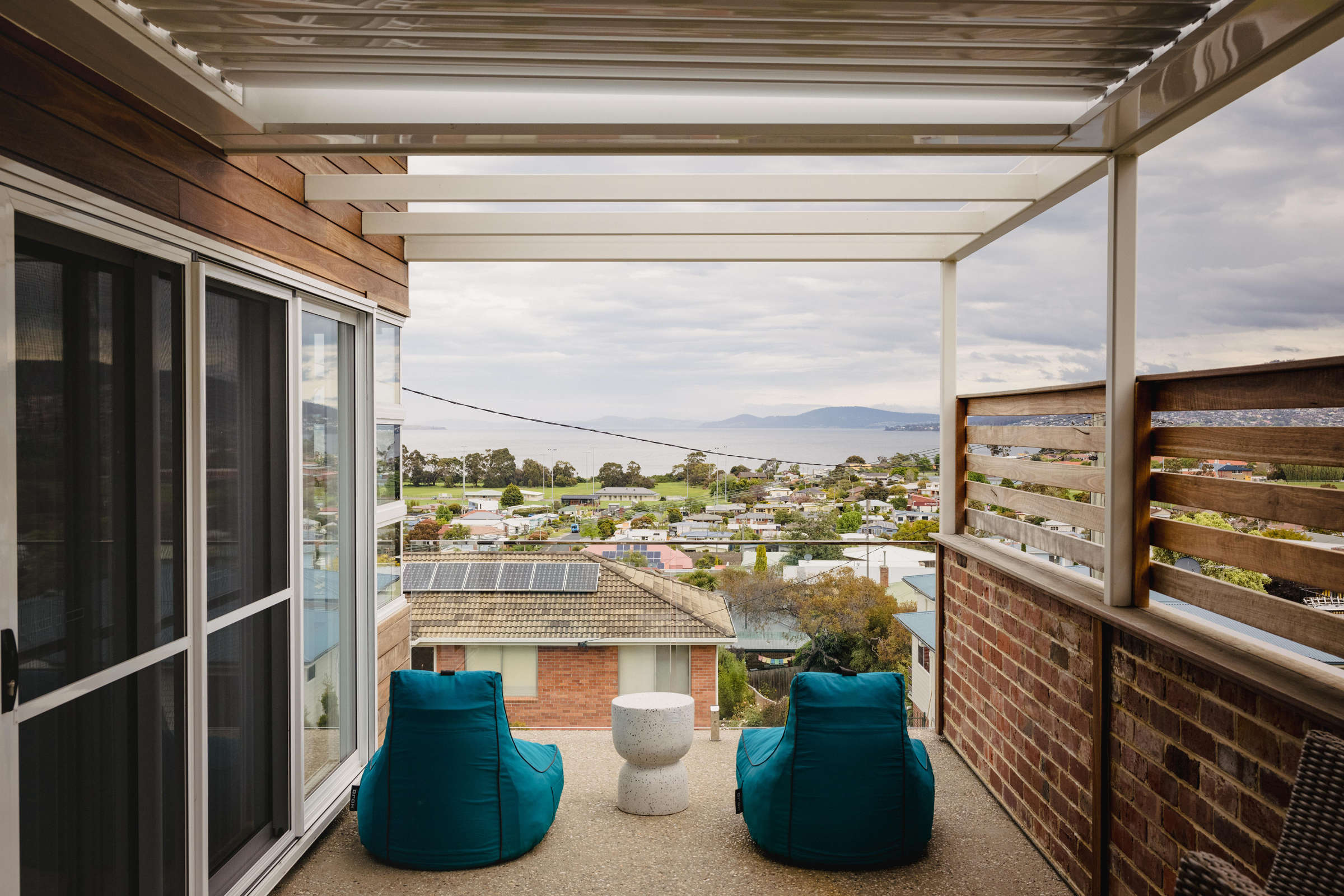 View of the River Derwent from the deck of this Howrah home renovation. The external deck features steel framework and a glass balustrade. Credit: Jordan Davis.