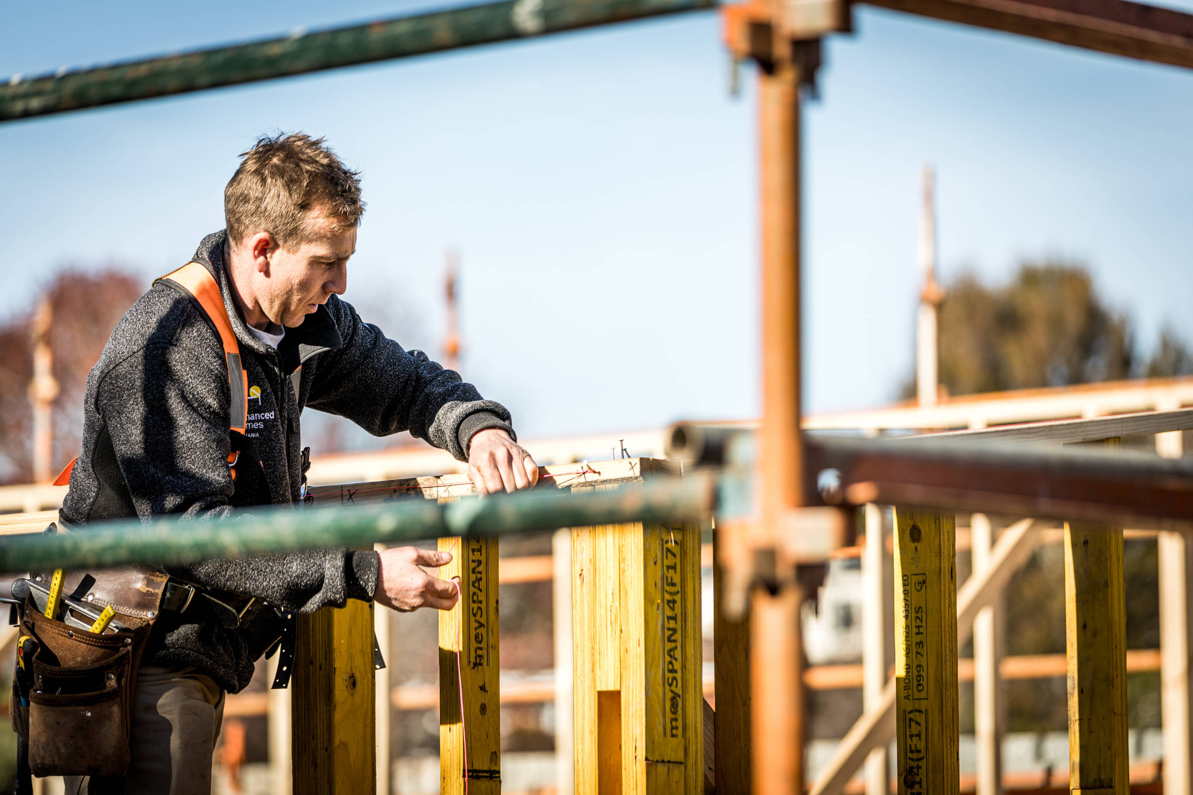 Experienced builder planning the next stage of timber framing for a client renovation. Credit: Natalie Mendham.