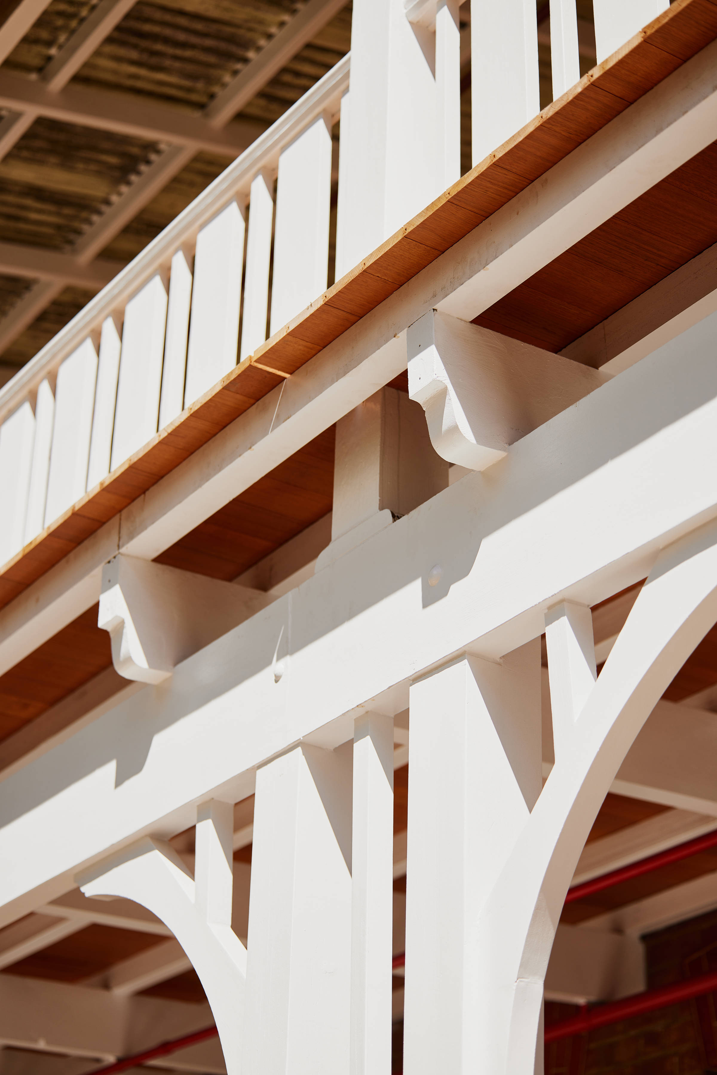 Closeup detailing of the freshly white painted decorative timber verandah supports and balustrades. Credit: Samuel Shelley.