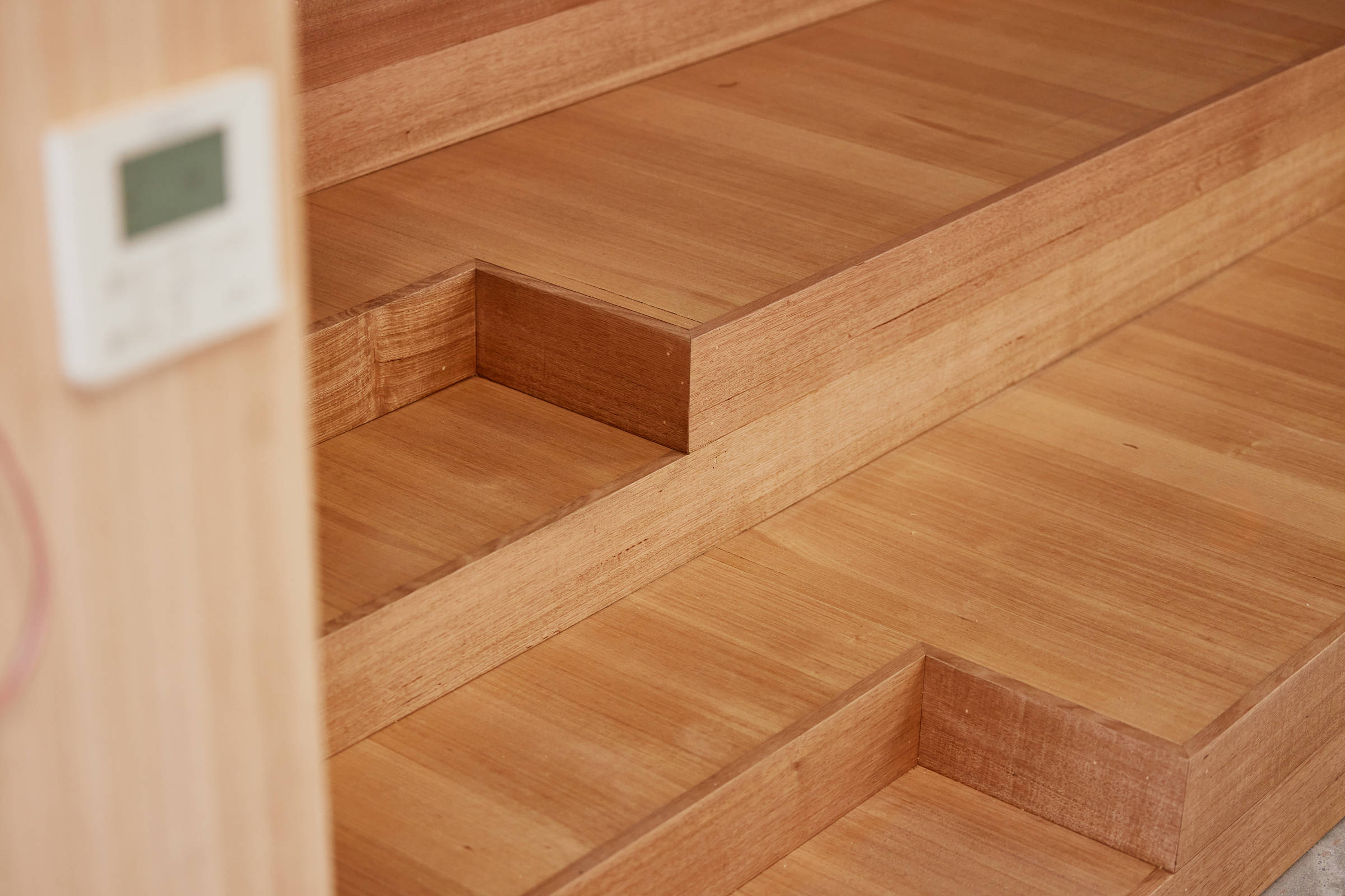 Closeup image of new Tasmanian oak stairs demonstrating exacting and precise carpentry work. Credit: Samuel Shelley.